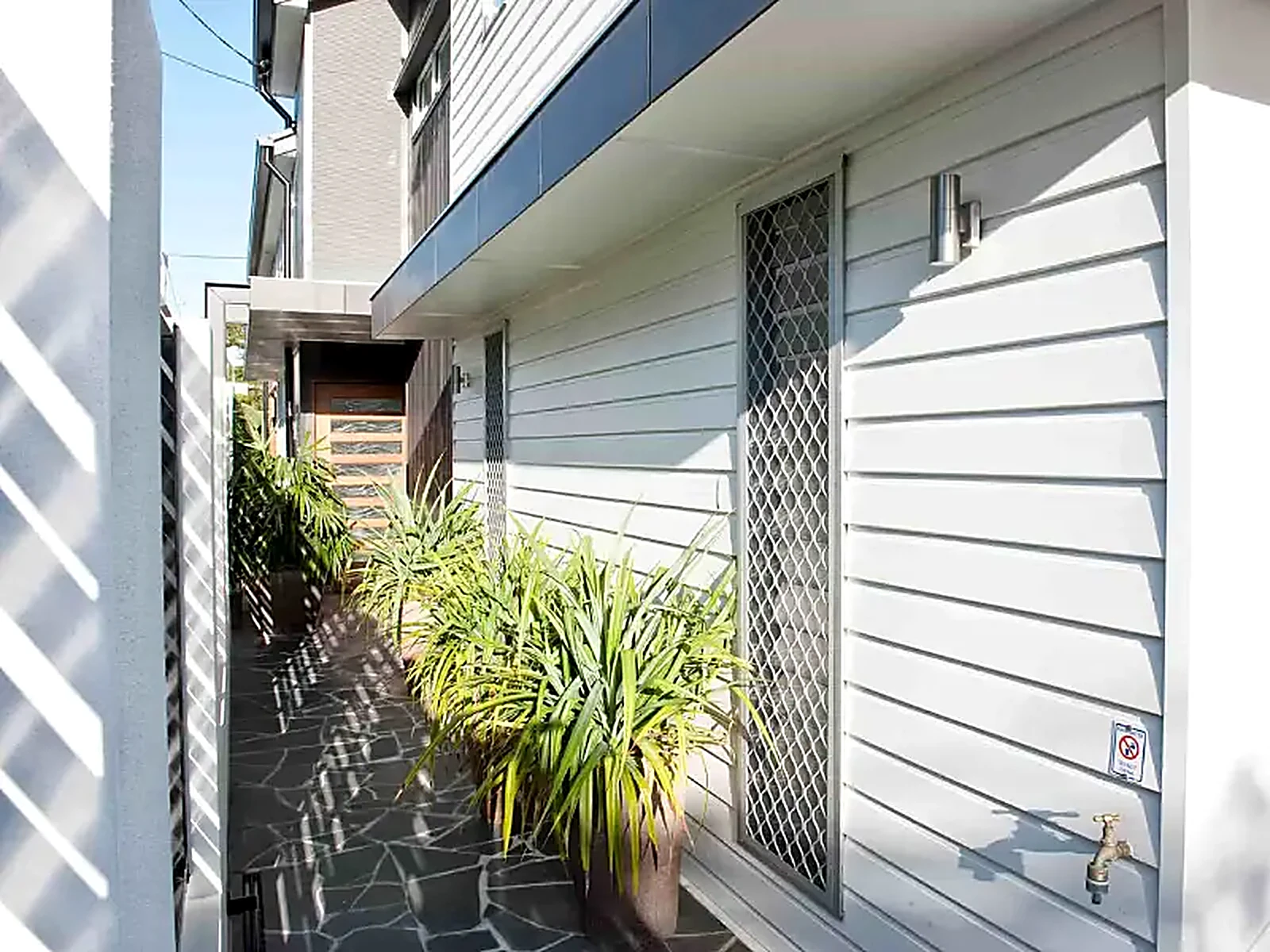 Diamond grille security door with welded one-piece design